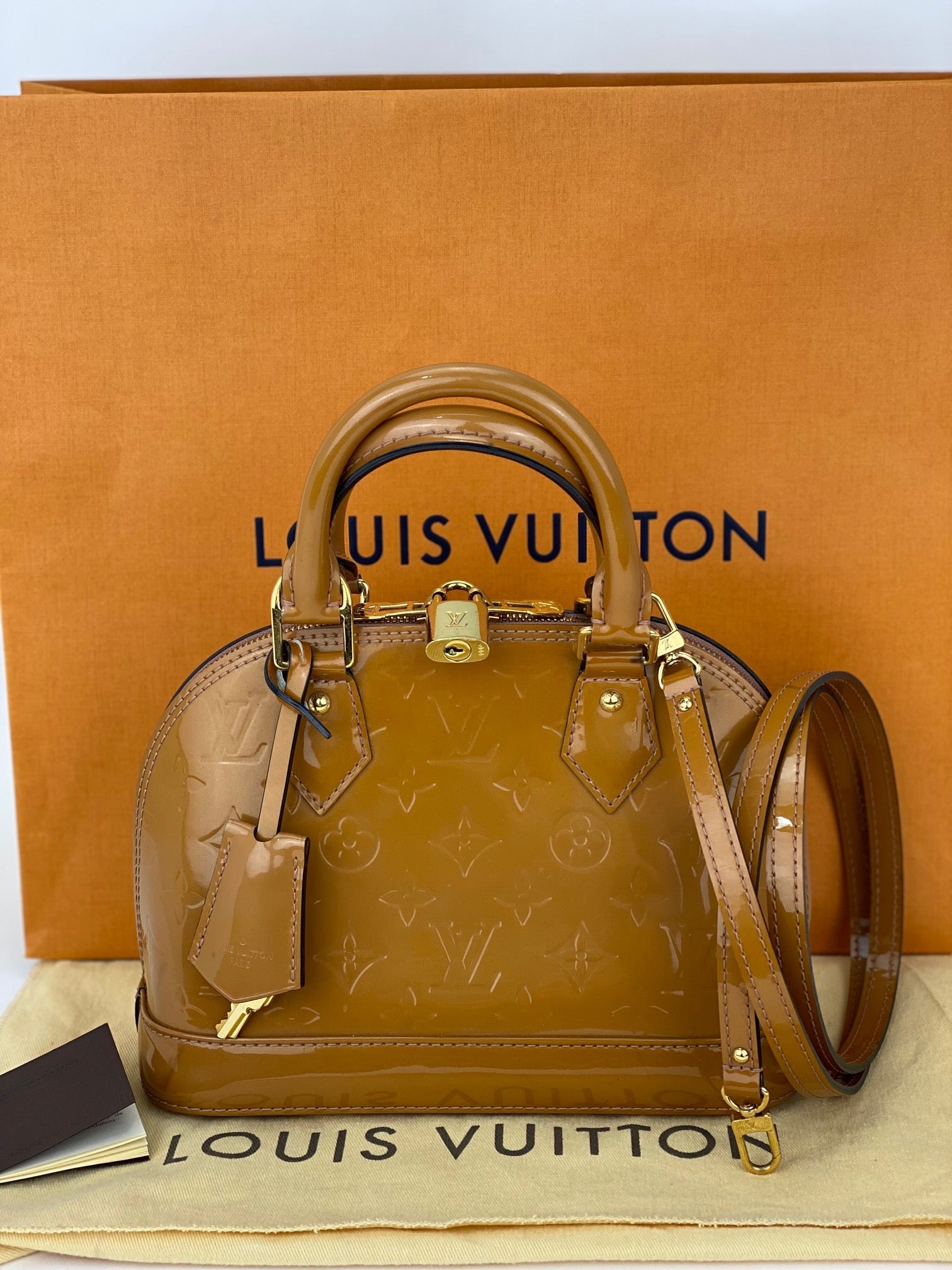 Túi xách đeo vai LOUIS VUITTON Vernis Alma BB Rose Velours M91585 đã qua sử dụng
