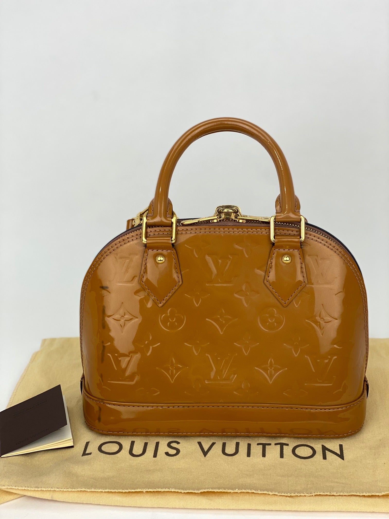 Túi xách đeo vai LOUIS VUITTON Vernis Alma BB Rose Velours M91585 đã qua sử dụng