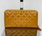 Ví cầm tay Chanel Quilted Yellow Patent Leather Brilliant Zip Around