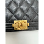 Ví cầm tay Chanel Caviar Quilted Mini Boy có dây xích màu đen