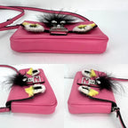 Túi đeo chéo Fendi Monster Baguette da hồng siêu nhỏ