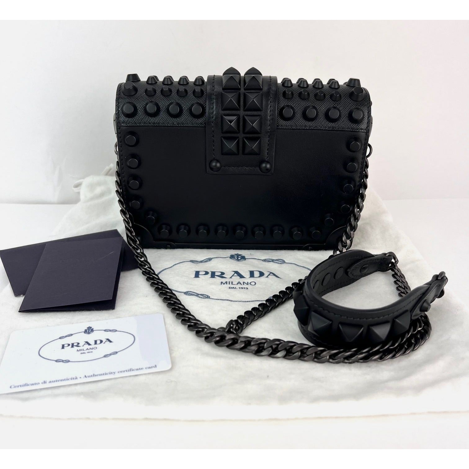 Túi đeo chéo Prada City Calfskin Saffiano Studded Cahier màu đen
